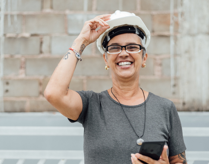 stock image of Black woman with a construction hat and sensible glasses